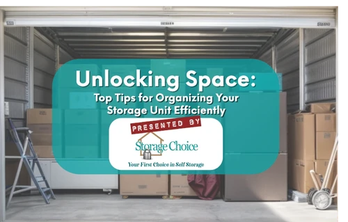 A storage unit is partially open, revealing its contents. There's an assortment of cardboard boxes, of various sizes,...